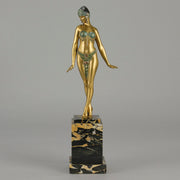 Alexandrian Dancer by Demetre Chiparus A fabulous Art Deco gilt bronze figure of a beautiful Egyptian dancer in full dance costume with her arms held by her sides, hand finished in stunning gilded and cold painted enamel colour, raised on a portoro marble base