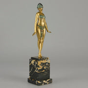 Alexandrian Dancer by Demetre Chiparus A fabulous Art Deco gilt bronze figure of a beautiful Egyptian dancer in full dance costume with her arms held by her sides, hand finished in stunning gilded and cold painted enamel colour, raised on a portoro marble base