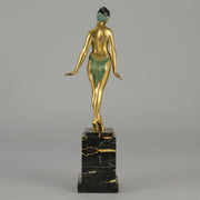 Alexandrian Dancer by Demetre Chiparus A fabulous Art Deco gilt bronze figure of a beautiful Egyptian dancer in full dance costume with her arms held by her sides, hand finished in stunning gilded and cold painted enamel colour, raised on a portoro marble base