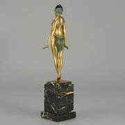Alexandrian Dancer by Demetre Chiparus A fabulous Art Deco gilt bronze figure of a beautiful Egyptian dancer in full dance costume with her arms held by her sides, hand finished in stunning gilded and cold painted enamel colour, raised on a portoro marble base