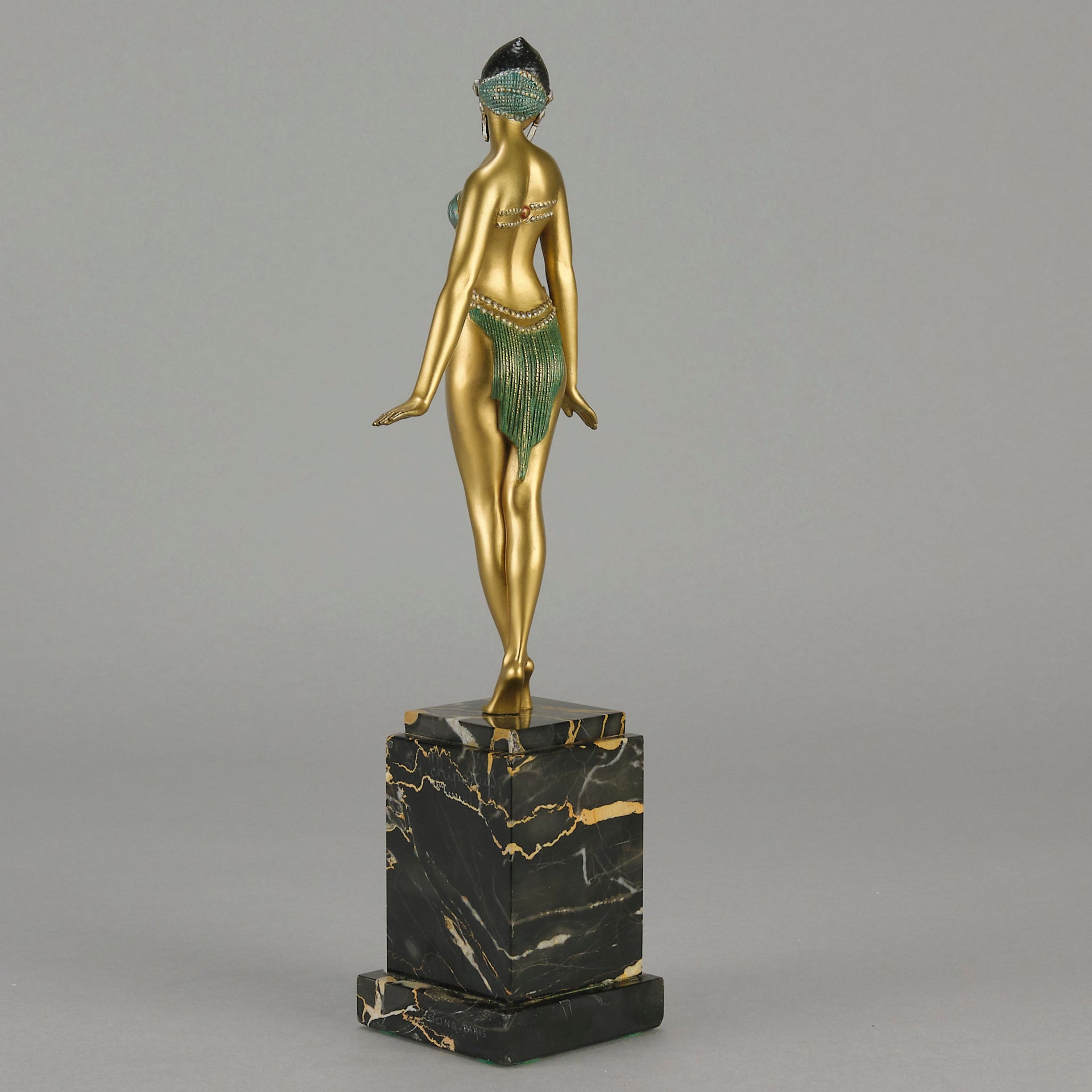 Alexandrian Dancer by Demetre Chiparus A fabulous Art Deco gilt bronze figure of a beautiful Egyptian dancer in full dance costume with her arms held by her sides, hand finished in stunning gilded and cold painted enamel colour, raised on a portoro marble base