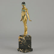 Alexandrian Dancer by Demetre Chiparus A fabulous Art Deco gilt bronze figure of a beautiful Egyptian dancer in full dance costume with her arms held by her sides, hand finished in stunning gilded and cold painted enamel colour, raised on a portoro marble base