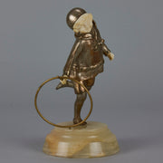 Bronze and ivory boy with hoop by Chiparus