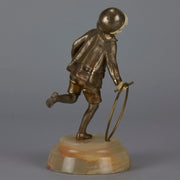 Bronze and ivory boy with hoop by Chiparus