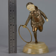 Bronze and ivory boy with hoop by Chiparus