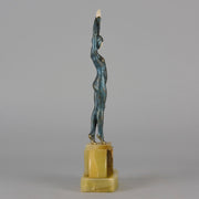  Starfish by Demetre Chiparus a  Art Deco cold painted silver and enamel bronze sculpture with ivory face and hands representing a young female Ballets Russes dancer wearing a metallic blue skin tight leotard further decorated in a bejewelled starfish pattern, modelled reaching upwards with both arms, her hands interlaced. Raised on a shaped onyx base