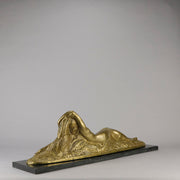 Été by Demetre Chiparus a fabulous Art Deco cold painted gilt and silver bronze figure of a beautiful young woman reclining on a bed of wheat sheaves