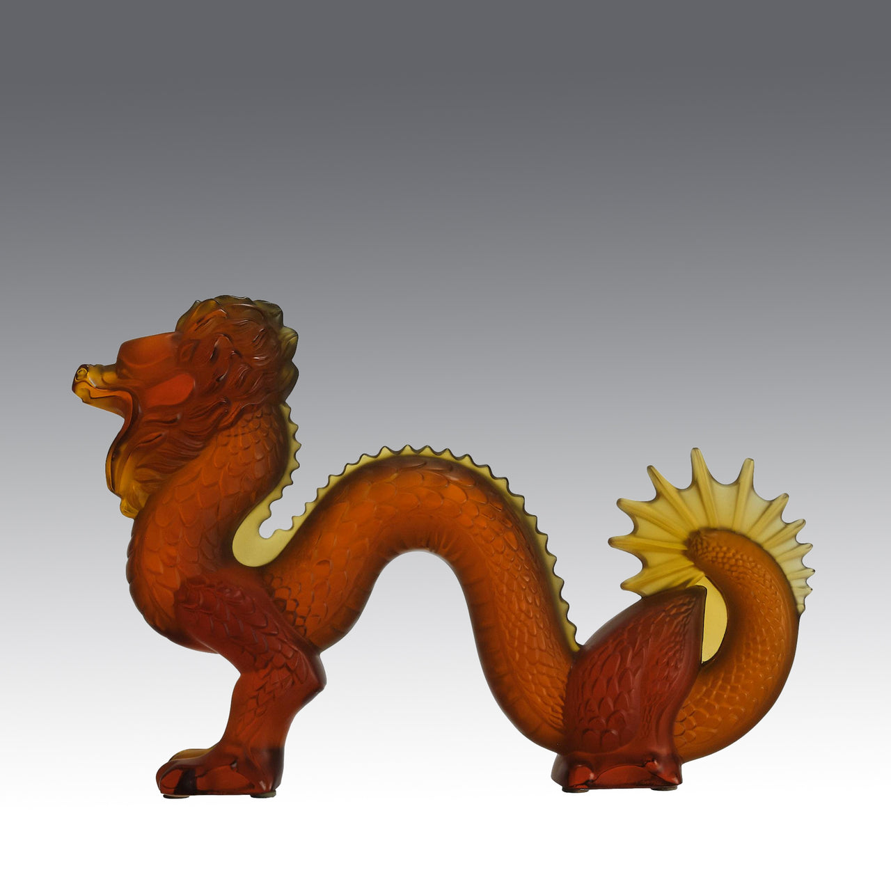 Oriental Dragon by Marie-Claude Lalique A striking mid 20th Century glass study of an Oriental dragon of undulating form with very fine hand chased surface detail and dramatic orange colour