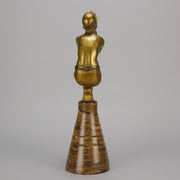 Oblivion by Georges Ducernet - Art Deco Statue 1930s a cold painted bronze figure of a dancer in a crouched pose holding a lidded urn. Exhibiting excellent colour and detail, raised on a conical marble plinth 