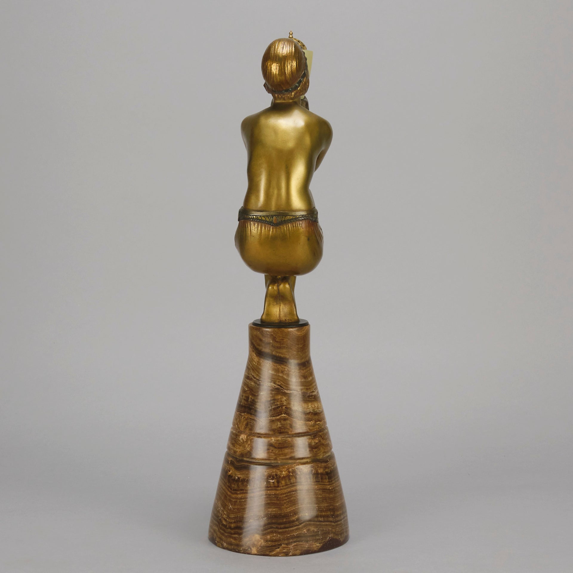 Oblivion by Georges Ducernet - Art Deco Statue 1930s a cold painted bronze figure of a dancer in a crouched pose holding a lidded urn. Exhibiting excellent colour and detail, raised on a conical marble plinth 