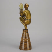 Oblivion by Georges Ducernet - Art Deco Statue 1930s a cold painted bronze figure of a dancer in a crouched pose holding a lidded urn. Exhibiting excellent colour and detail, raised on a conical marble plinth 