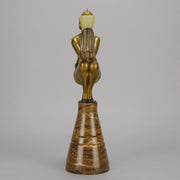 Oblivion by Georges Ducernet - Art Deco Statue 1930s a cold painted bronze figure of a dancer in a crouched pose holding a lidded urn. Exhibiting excellent colour and detail, raised on a conical marble plinth 