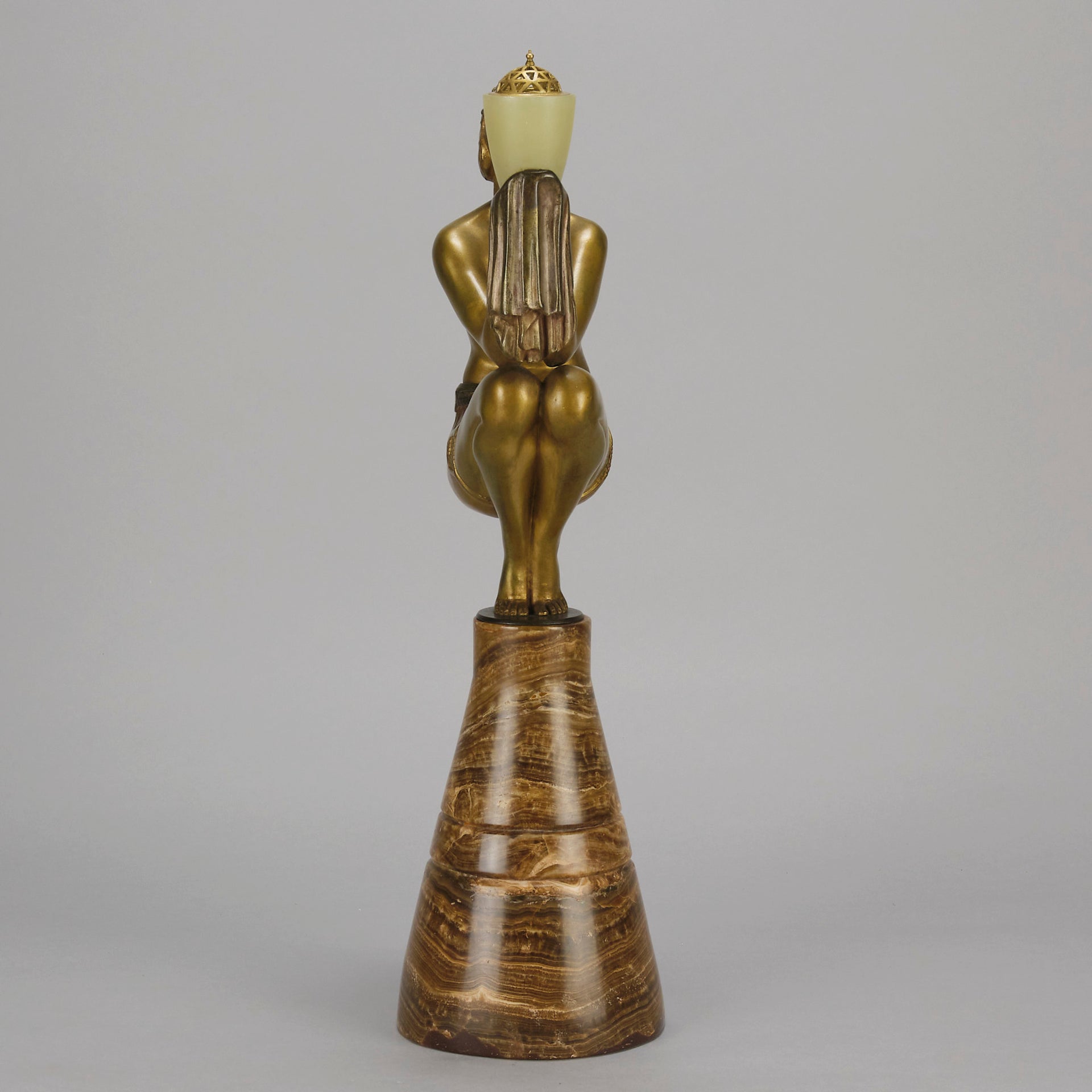 Oblivion by Georges Ducernet - Art Deco Statue 1930s a cold painted bronze figure of a dancer in a crouched pose holding a lidded urn. Exhibiting excellent colour and detail, raised on a conical marble plinth 