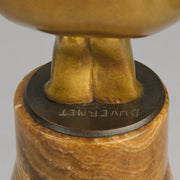 Oblivion by Georges Ducernet - Art Deco Statue 1930s a cold painted bronze figure of a dancer in a crouched pose holding a lidded urn. Exhibiting excellent colour and detail, raised on a conical marble plinth 