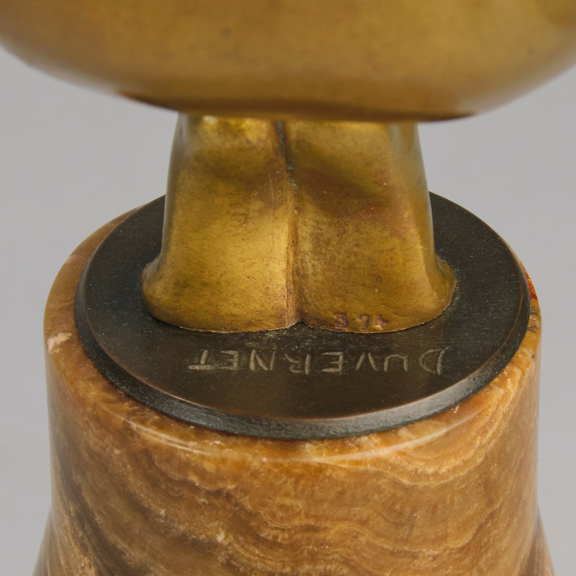 Oblivion by Georges Ducernet - Art Deco Statue 1930s a cold painted bronze figure of a dancer in a crouched pose holding a lidded urn. Exhibiting excellent colour and detail, raised on a conical marble plinth 