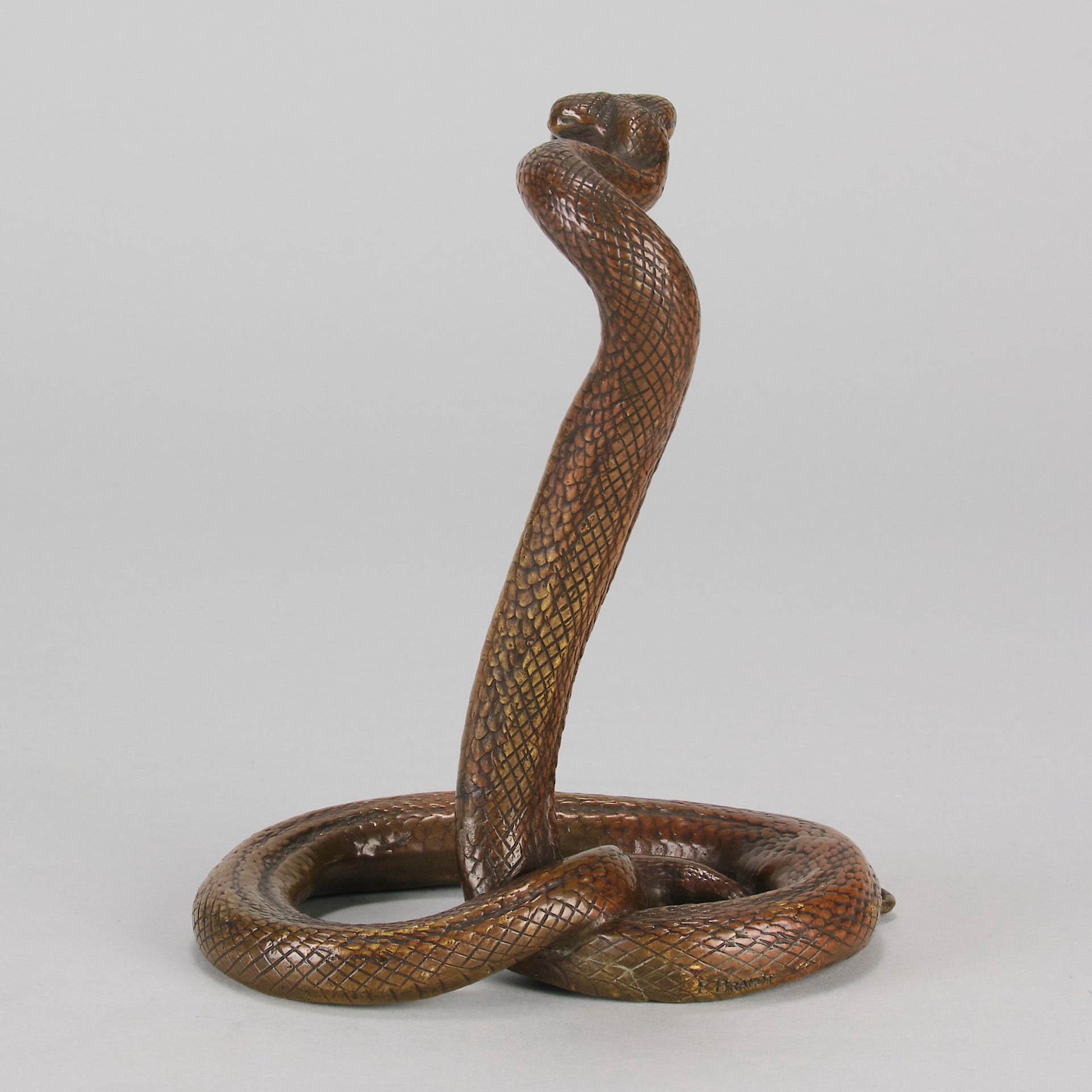 Rearing Snake an early 20th Century Art Deco bronze study of a rearing snake, its tail curled and head raised in an alert position by Edgar Brandt 