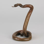 Rearing Snake an early 20th Century Art Deco bronze study of a rearing snake, its tail curled and head raised in an alert position by Edgar Brandt 