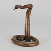 Rearing Snake an early 20th Century Art Deco bronze study of a rearing snake, its tail curled and head raised in an alert position by Edgar Brandt 