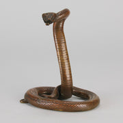 Rearing Snake an early 20th Century Art Deco bronze study of a rearing snake, its tail curled and head raised in an alert position by Edgar Brandt 