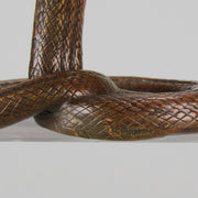Rearing Snake an early 20th Century Art Deco bronze study of a rearing snake, its tail curled and head raised in an alert position by Edgar Brandt 