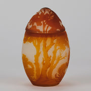 Easter  Egg Vase with Bunny by Émile Gallé. A beautiful and very rare early 20th Century cameo glass lidded egg shaped vase acid cut and etched with an Easter bunny sitting on a nest of eggs under the boughs of some trees in deep orange on a cream/ivory field