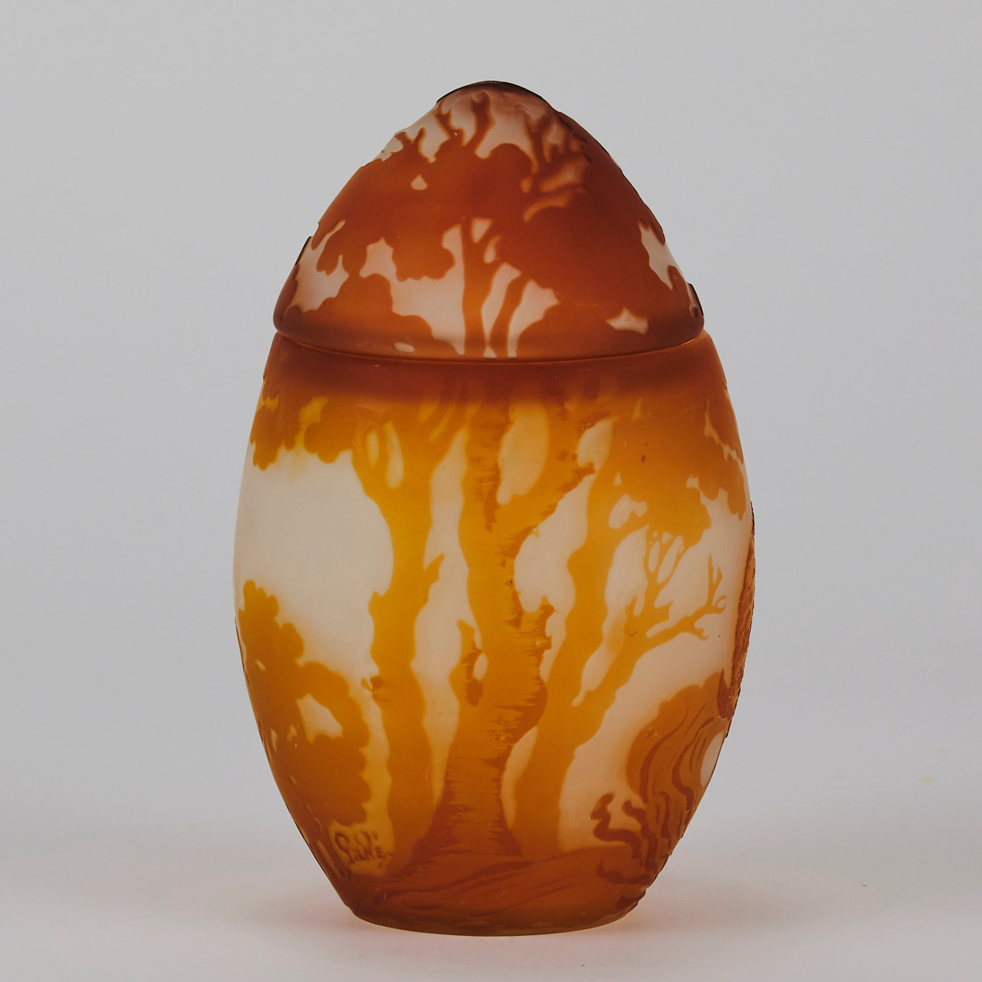 Easter  Egg Vase with Bunny by Émile Gallé. A beautiful and very rare early 20th Century cameo glass lidded egg shaped vase acid cut and etched with an Easter bunny sitting on a nest of eggs under the boughs of some trees in deep orange on a cream/ivory field
