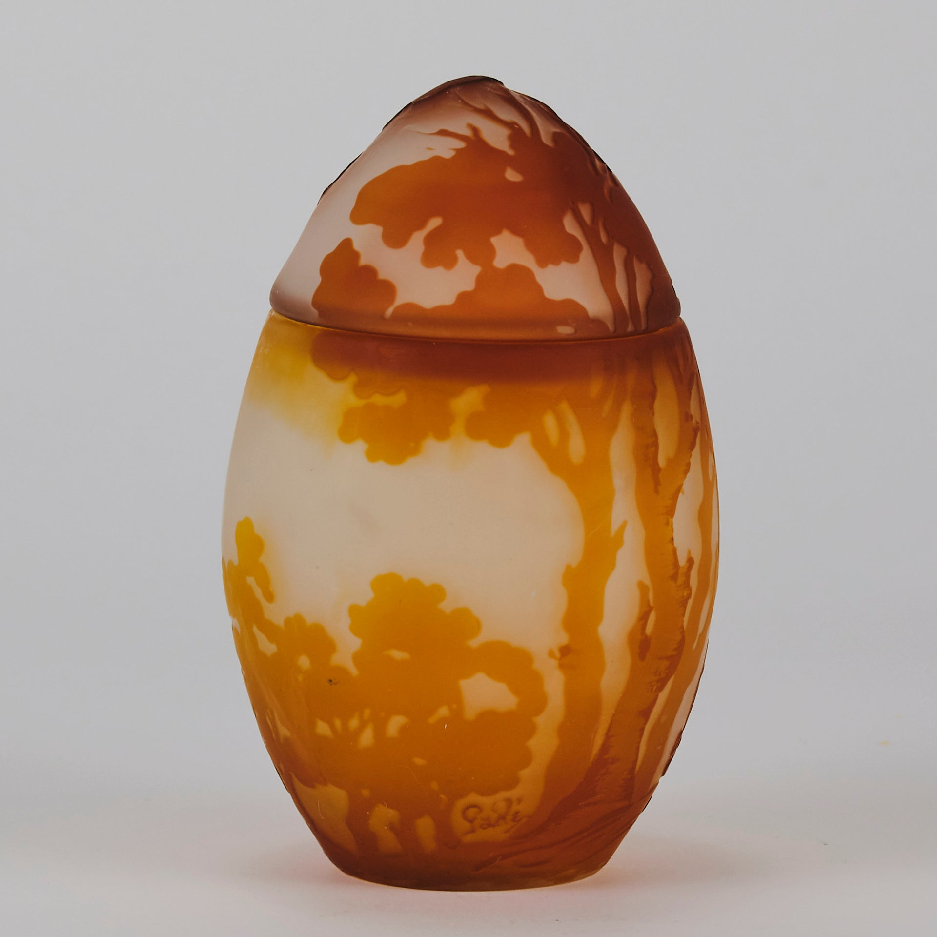 Easter  Egg Vase with Bunny by Émile Gallé. A beautiful and very rare early 20th Century cameo glass lidded egg shaped vase acid cut and etched with an Easter bunny sitting on a nest of eggs under the boughs of some trees in deep orange on a cream/ivory field