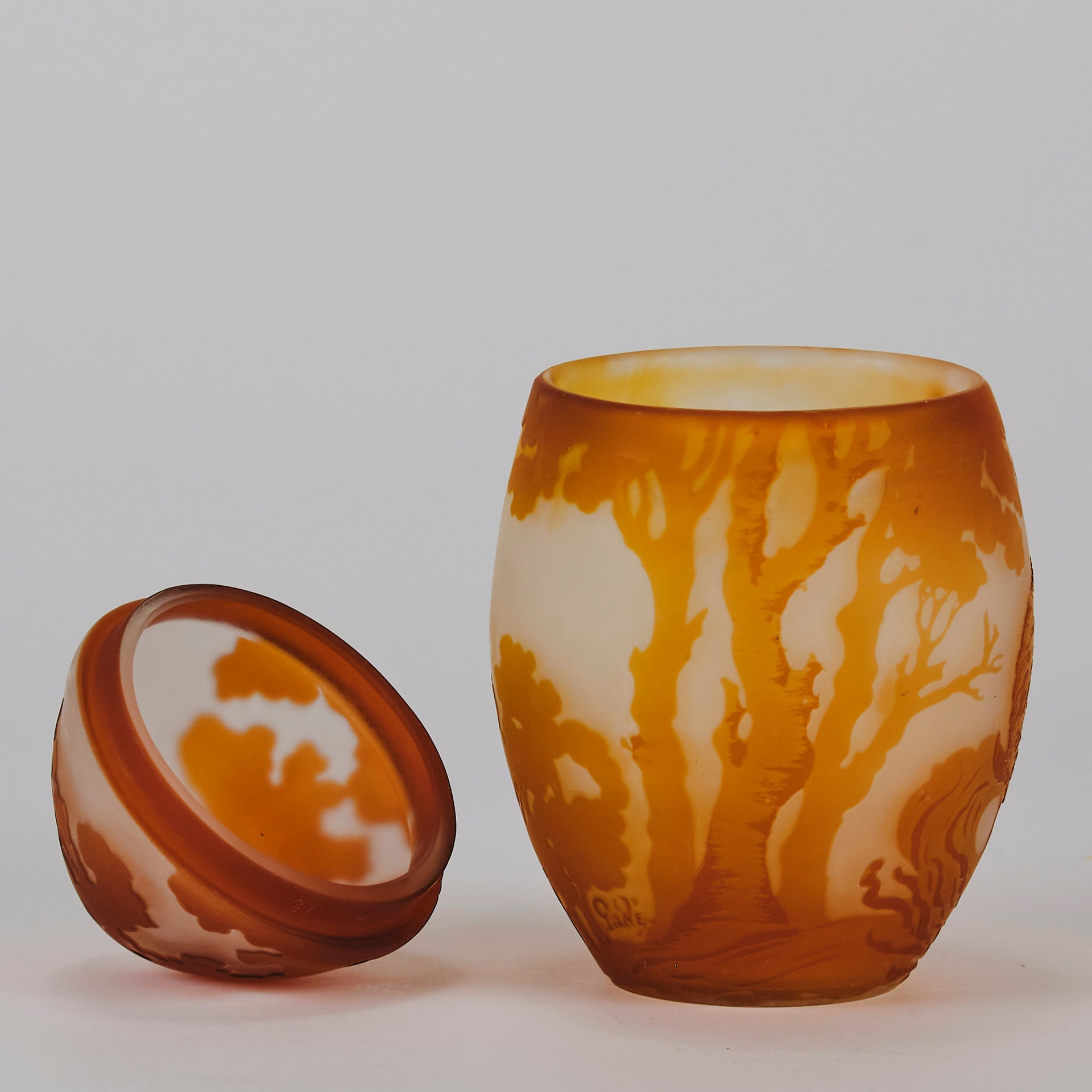 Easter  Egg Vase with Bunny by Émile Gallé. A beautiful and very rare early 20th Century cameo glass lidded egg shaped vase acid cut and etched with an Easter bunny sitting on a nest of eggs under the boughs of some trees in deep orange on a cream/ivory field