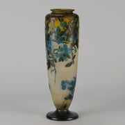 Art Nouveau Glass Vase Fruiting Sloe Berries by Emile Gallé An early 20th Century cameo glass vase acid cut and etched with a fruiting tree branch blooming with electric blue sloe berries against a pale cream/yellow background