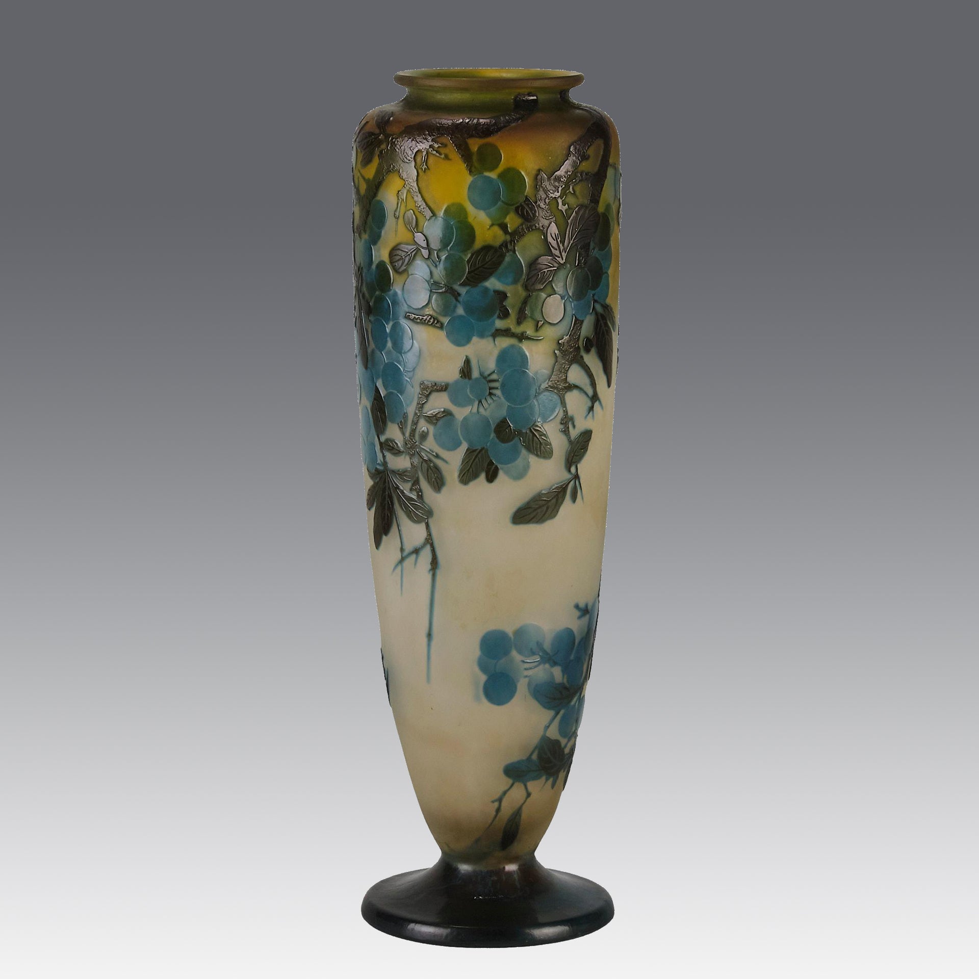 Art Nouveau Glass Vase Fruiting Sloe Berries by Emile Gallé An early 20th Century cameo glass vase acid cut and etched with a fruiting tree branch blooming with electric blue sloe berries against a pale cream/yellow background
