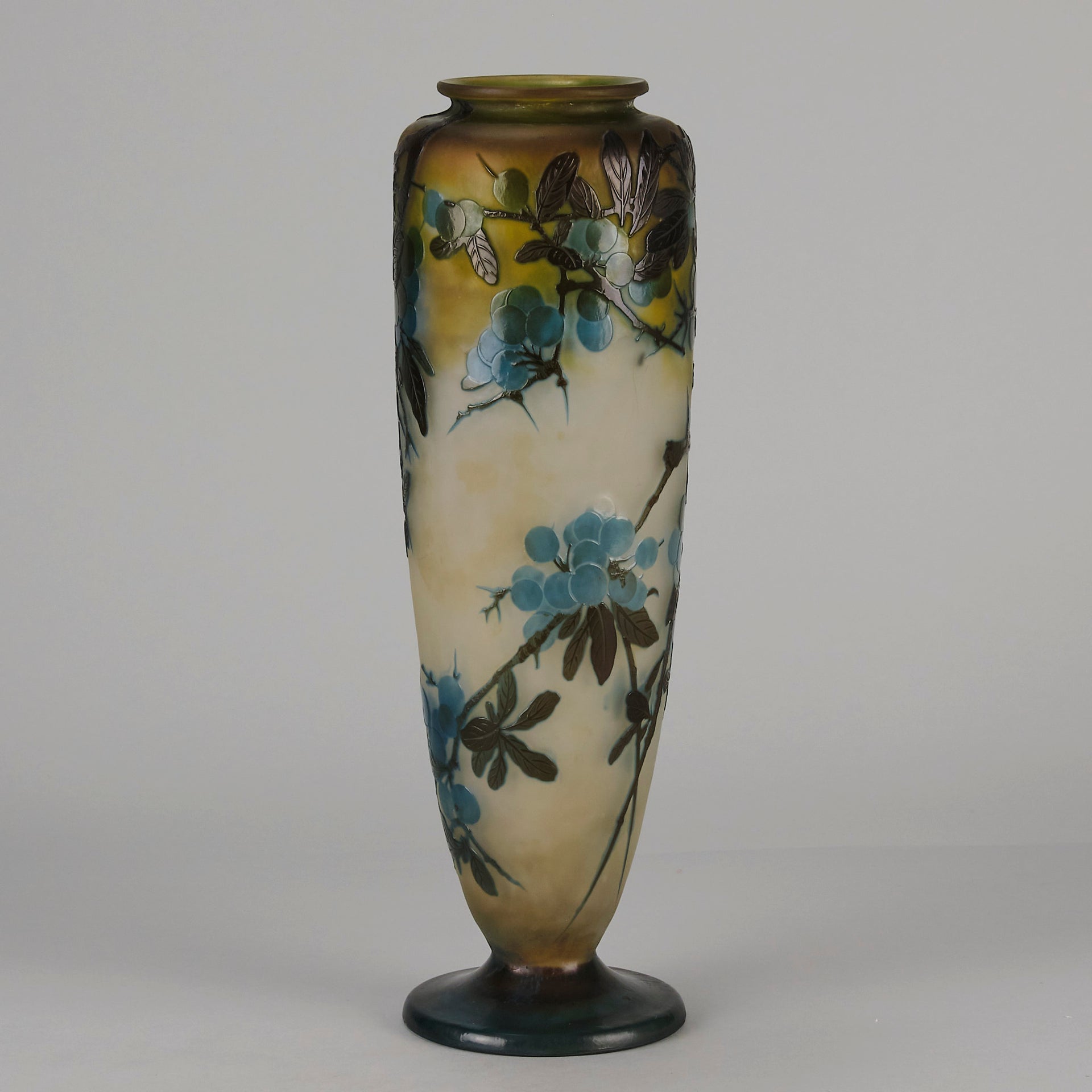 Art Nouveau Glass Vase Fruiting Sloe Berries by Emile Gallé An early 20th Century cameo glass vase acid cut and etched with a fruiting tree branch blooming with electric blue sloe berries against a pale cream/yellow background