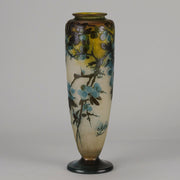 Art Nouveau Glass Vase Fruiting Sloe Berries by Emile Gallé An early 20th Century cameo glass vase acid cut and etched with a fruiting tree branch blooming with electric blue sloe berries against a pale cream/yellow background