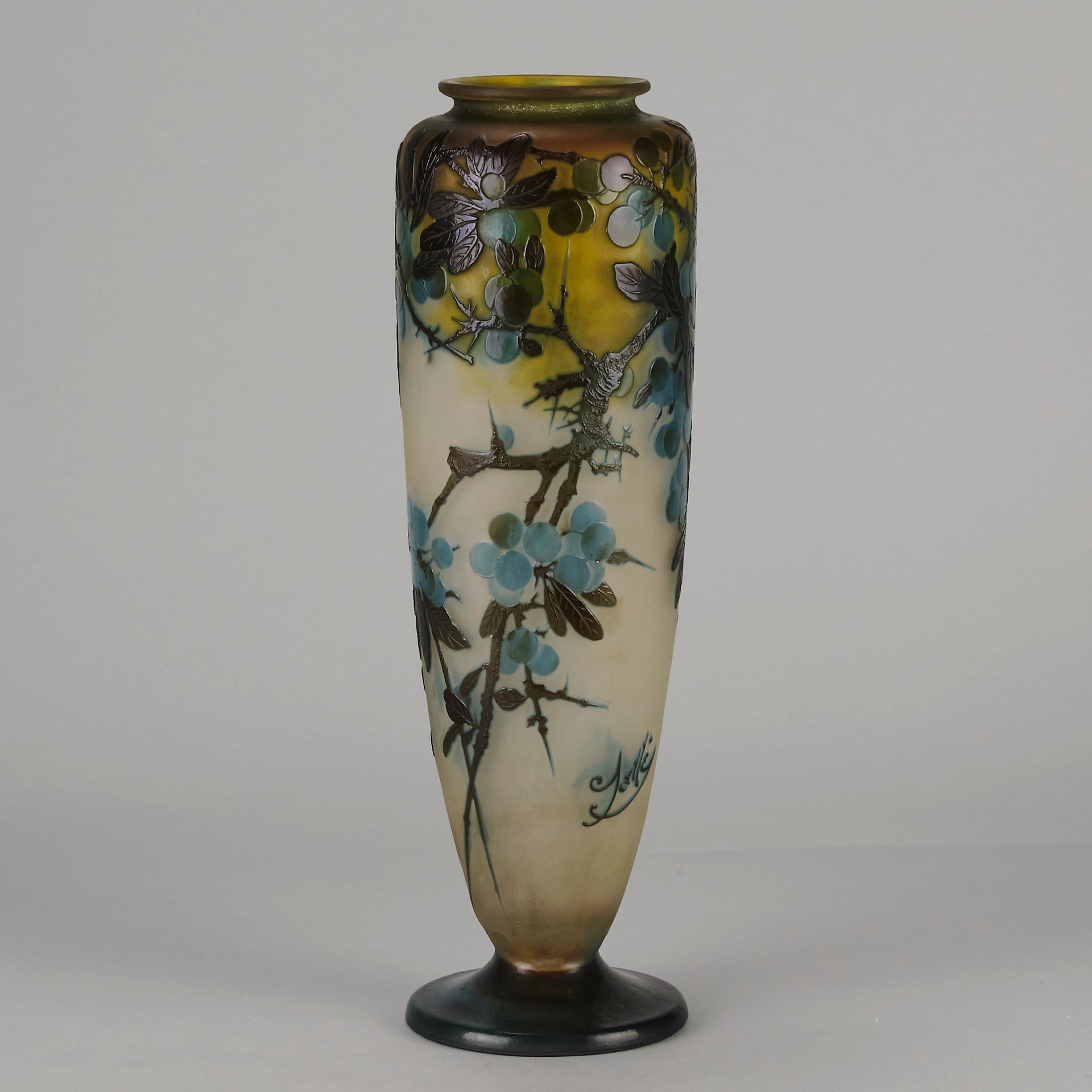 Art Nouveau Glass Vase Fruiting Sloe Berries by Emile Gallé An early 20th Century cameo glass vase acid cut and etched with a fruiting tree branch blooming with electric blue sloe berries against a pale cream/yellow background