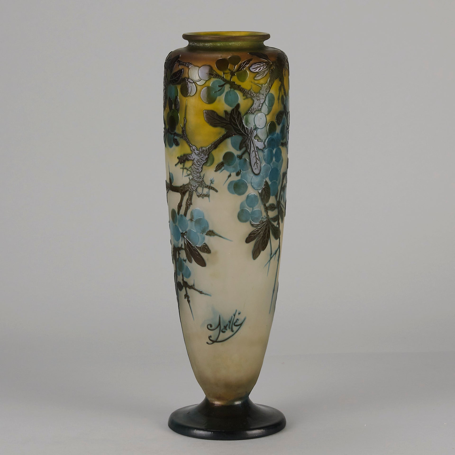 Art Nouveau Glass Vase Fruiting Sloe Berries by Emile Gallé An early 20th Century cameo glass vase acid cut and etched with a fruiting tree branch blooming with electric blue sloe berries against a pale cream/yellow background