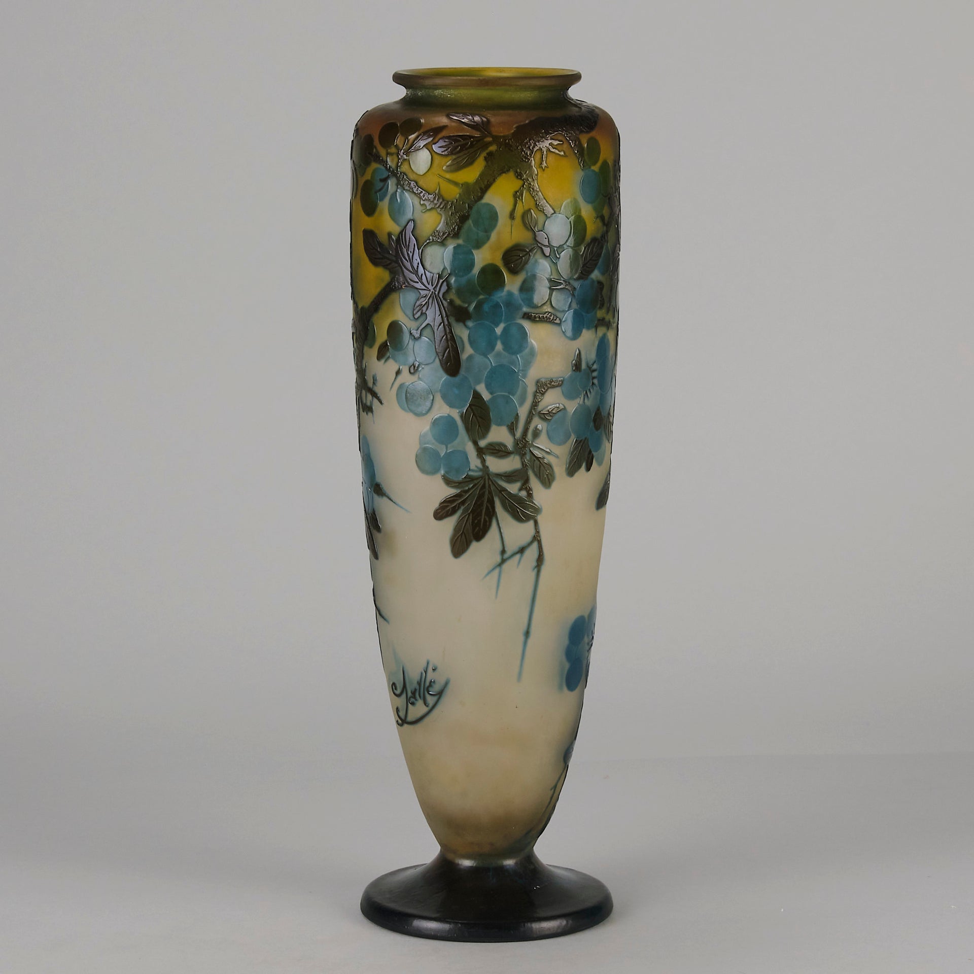 Art Nouveau Glass Vase Fruiting Sloe Berries by Emile Gallé An early 20th Century cameo glass vase acid cut and etched with a fruiting tree branch blooming with electric blue sloe berries against a pale cream/yellow background