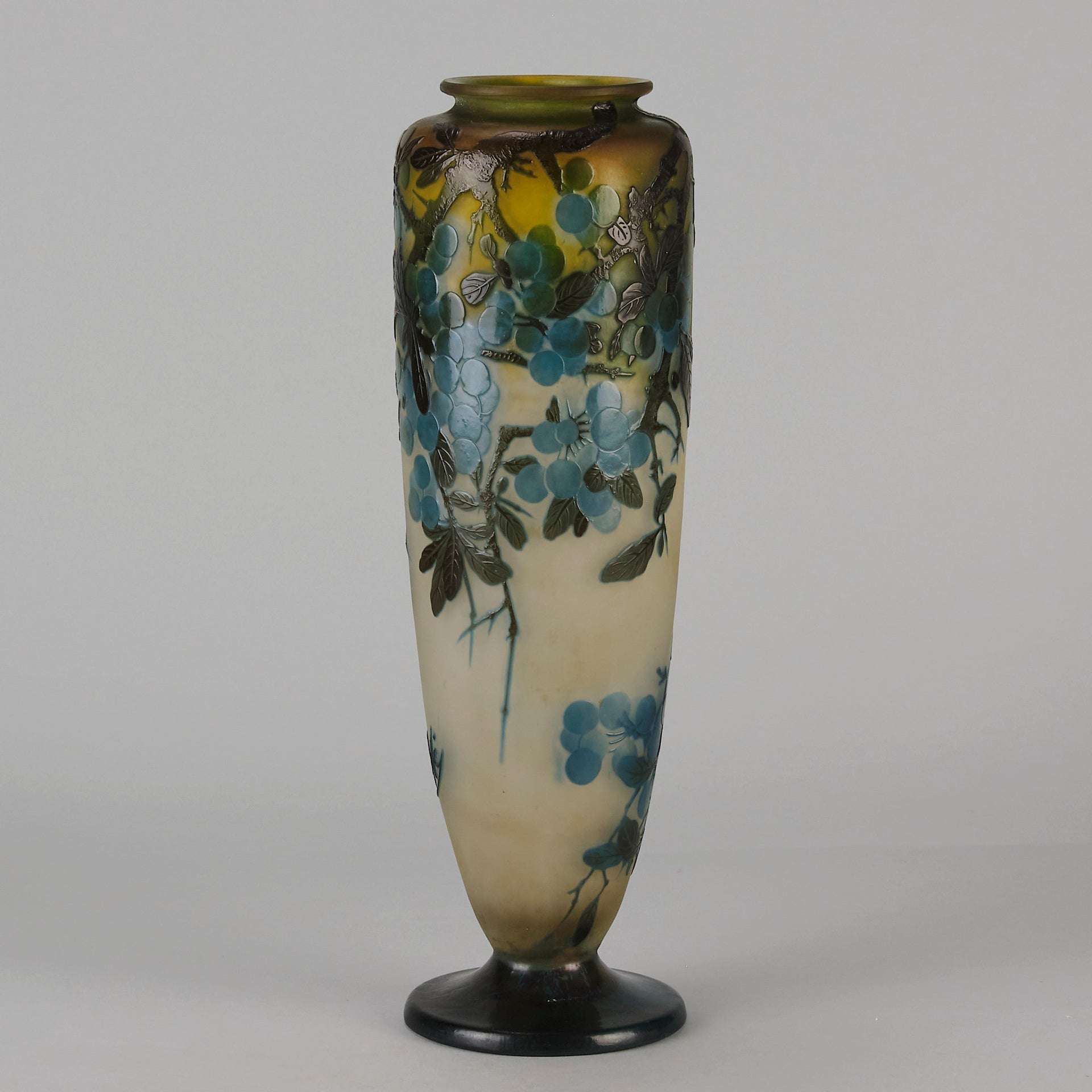 Art Nouveau Glass Vase Fruiting Sloe Berries by Emile Gallé An early 20th Century cameo glass vase acid cut and etched with a fruiting tree branch blooming with electric blue sloe berries against a pale cream/yellow background
