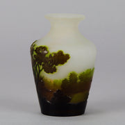 Green Landscape Vase by Emile Gallé An excellent late 19th Century cameo glass vase decorated with a deep green and burgundy landscape against a white field with fabulous detail and colour