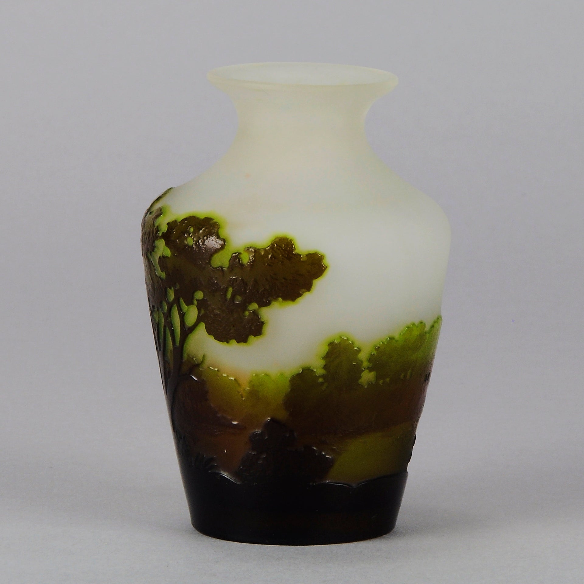 Green Landscape Vase by Emile Gallé An excellent late 19th Century cameo glass vase decorated with a deep green and burgundy landscape against a white field with fabulous detail and colour