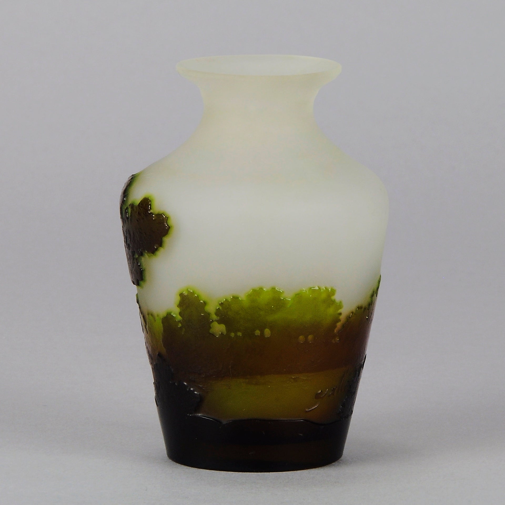 Green Landscape Vase by Emile Gallé An excellent late 19th Century cameo glass vase decorated with a deep green and burgundy landscape against a white field with fabulous detail and colour