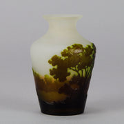 Green Landscape Vase by Emile Gallé An excellent late 19th Century cameo glass vase decorated with a deep green and burgundy landscape against a white field with fabulous detail and colour