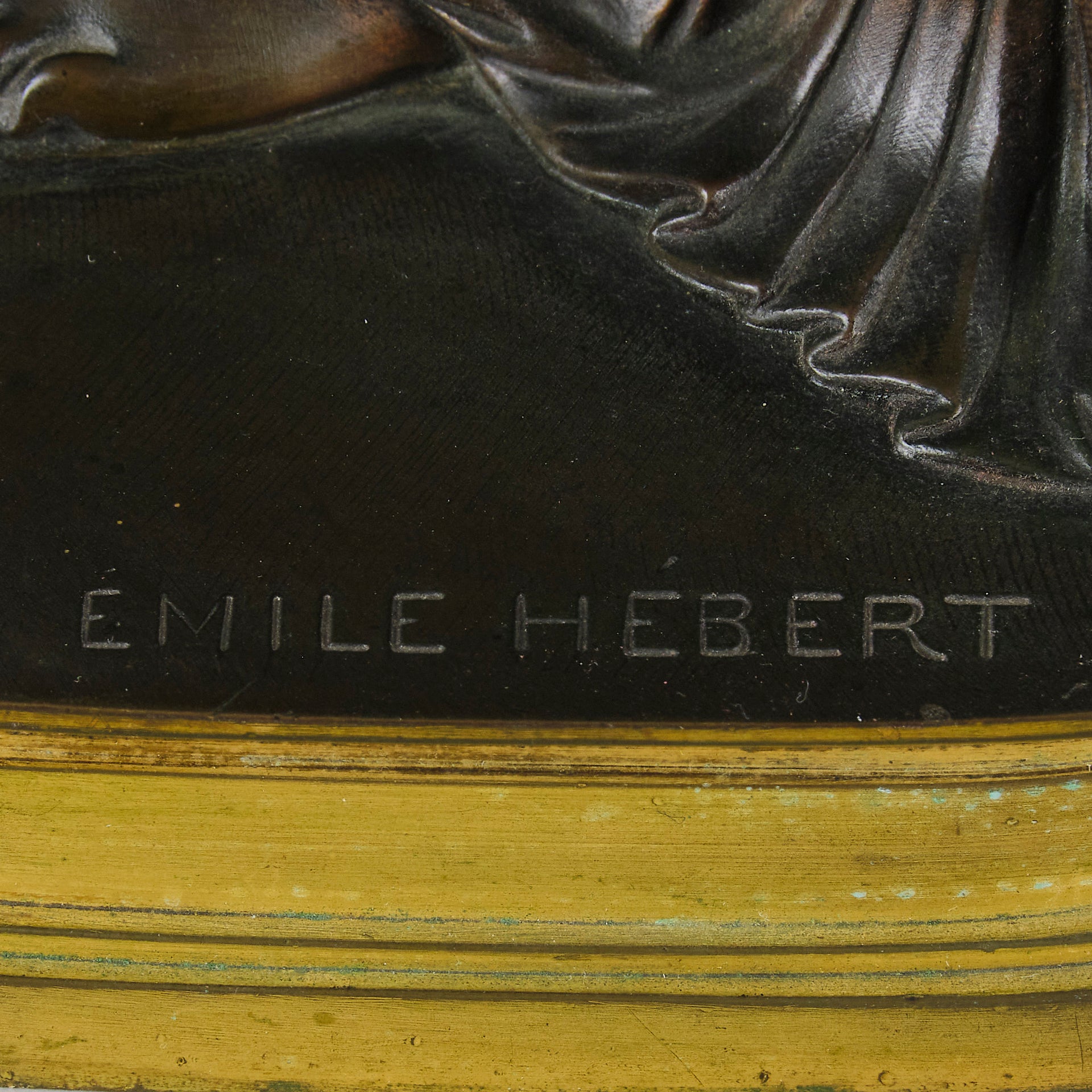 Thetis by Emile Hébert - a French late 19th Century bronze, of a striking female warrior figure known as Thetis the Greek Goddess of War. She is adjusting her shin guards in preparation for her next opponent, whilst sitting on an anvil. Raised on top of a partly gilded base