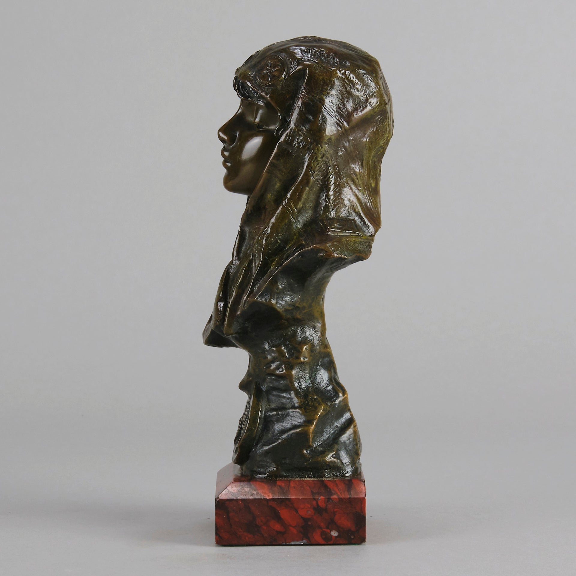 Dalila by Emmanuel Villanis a fantastic depiction of a young Deliah as a bronze bust. Covering her head with a hood