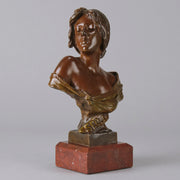 Seule by Emmanuel Villanis a very fine late 19th Century French bronze bust of an attractive classical maiden modelled in the Art Nouveau style, with fabulous variegating red and brown colour