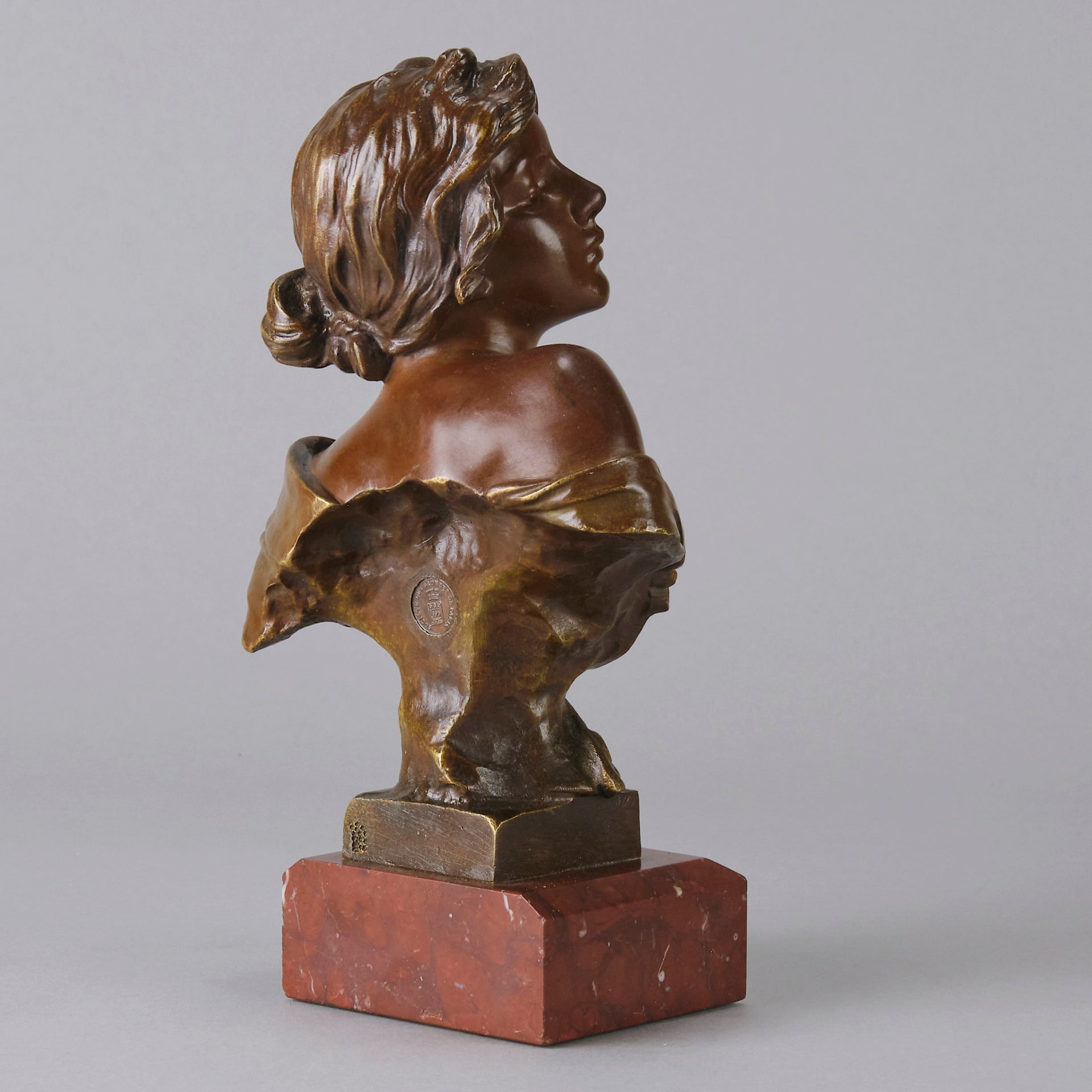 Seule by Emmanuel Villanis a very fine late 19th Century French bronze bust of an attractive classical maiden modelled in the Art Nouveau style, with fabulous variegating red and brown colour