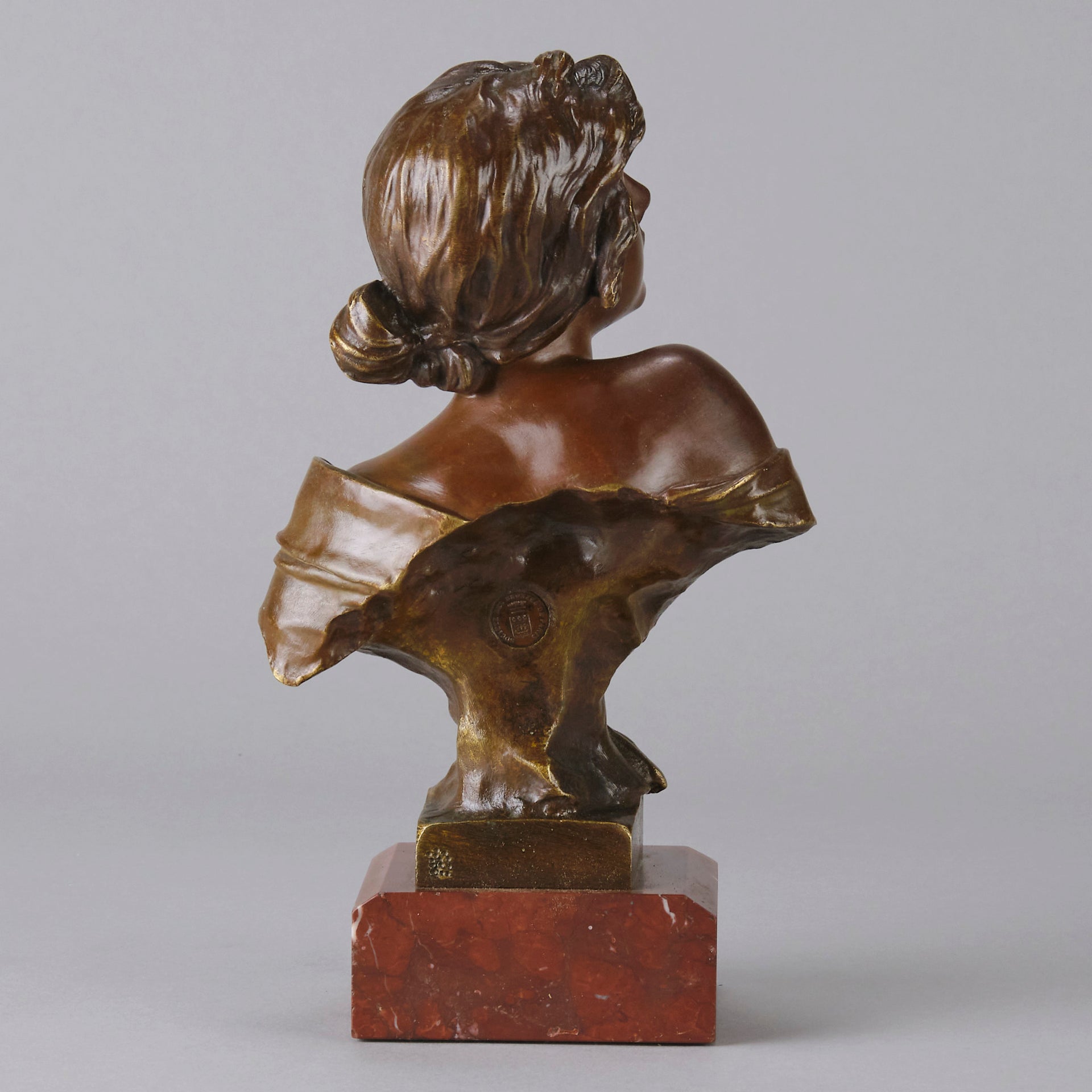 Seule by Emmanuel Villanis a very fine late 19th Century French bronze bust of an attractive classical maiden modelled in the Art Nouveau style, with fabulous variegating red and brown colour