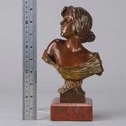 Seule by Emmanuel Villanis a very fine late 19th Century French bronze bust of an attractive classical maiden modelled in the Art Nouveau style, with fabulous variegating red and brown colour