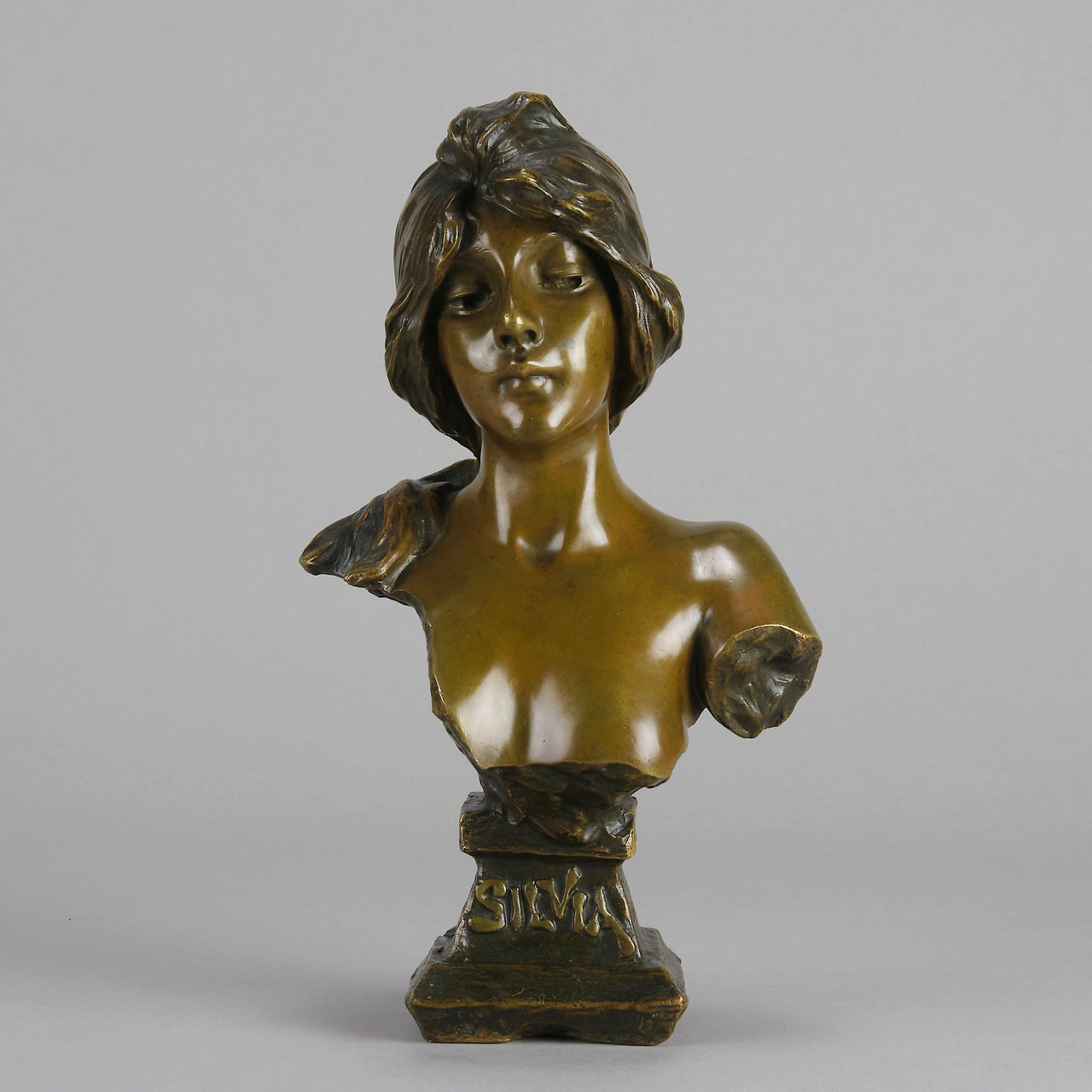 Silvia by Emmanuel Villanis a very fine late 19th Century French bronze bust of an attractive classical maiden modelled in the Art Nouveau style, with fabulous multi hued patination of brown and a subtle green
