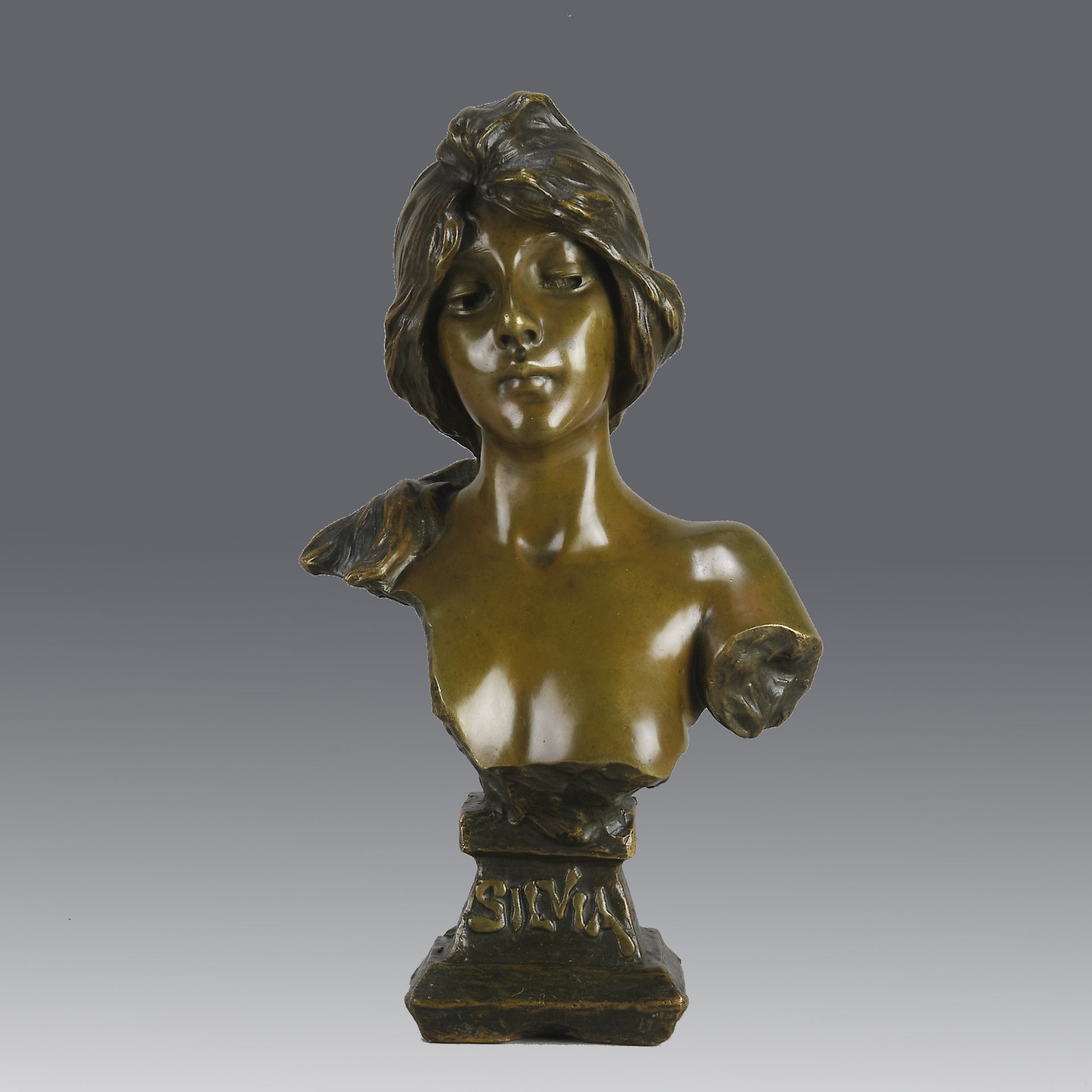 Silvia by Emmanuel Villanis a very fine late 19th Century French bronze bust of an attractive classical maiden modelled in the Art Nouveau style, with fabulous multi hued patination of brown and a subtle green