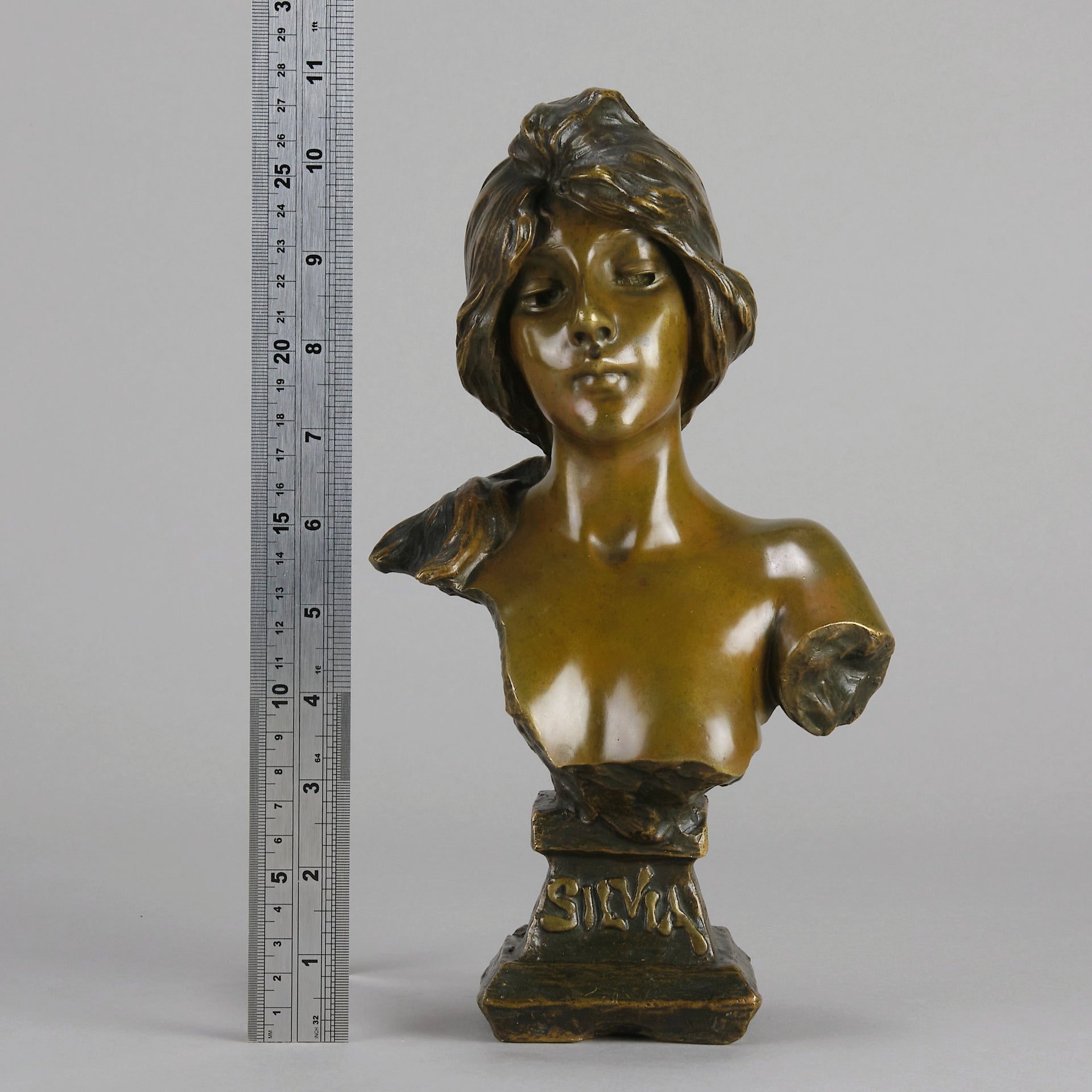 Silvia by Emmanuel Villanis a very fine late 19th Century French bronze bust of an attractive classical maiden modelled in the Art Nouveau style, with fabulous multi hued patination of brown and a subtle green