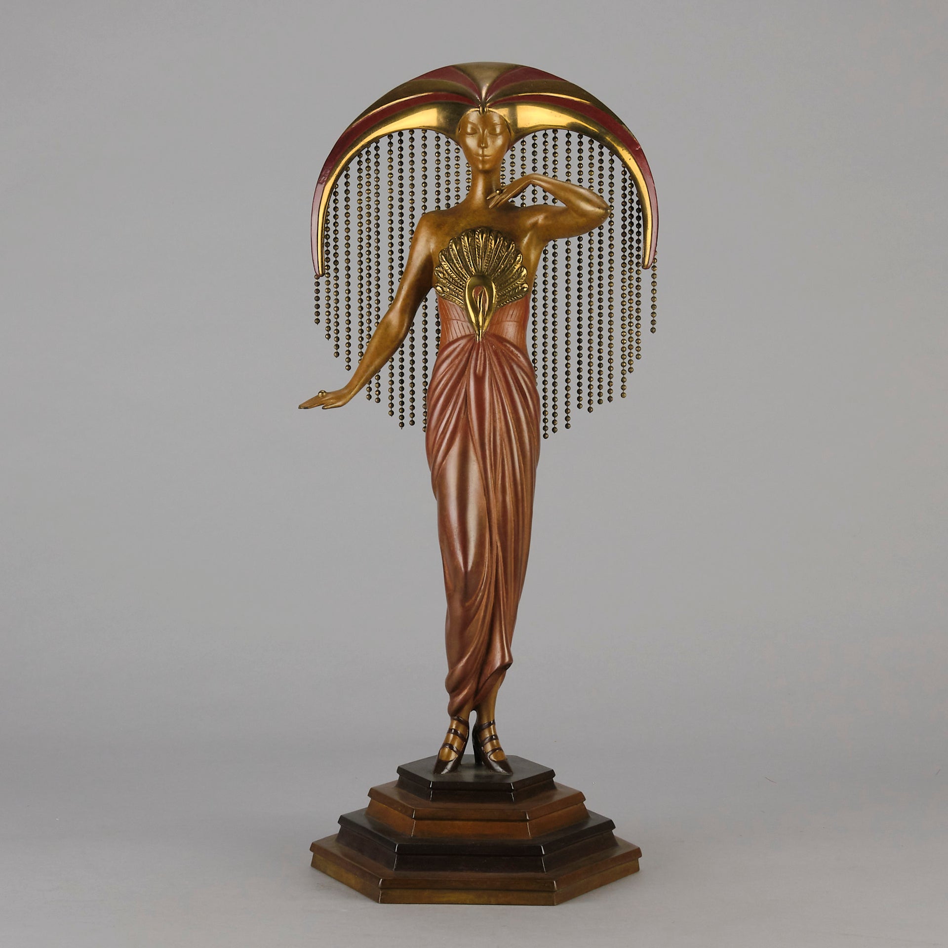 Le Soleil by Erte Art Deco bronze of a beautiful young woman in diaphanous dress wearing a spectacular headdress of circular form representing the sun - Hickmet Fine Arts